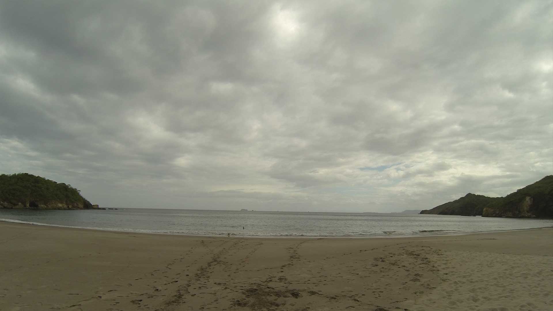 Dramatic cloudy fisheye view of Playa Mina beach in Guanacaste, Costa Rica