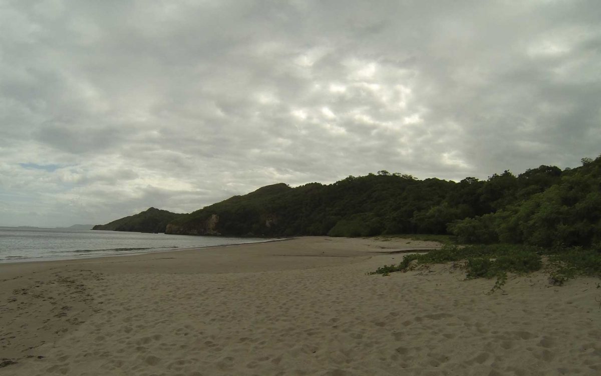 Cloudy day at empty Playa Mina sandy beach in Guanacaste, Costa Rica